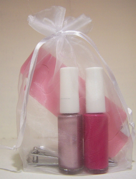 Two Bottles Of Nail Polish With Nail Clipper & Toe Separators